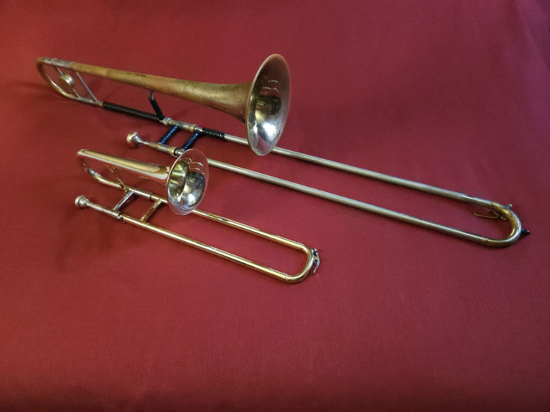 Comparison photo of a tenor trombone and slide trumpet together